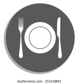 Place setting with plate, knife and fork on a grey background