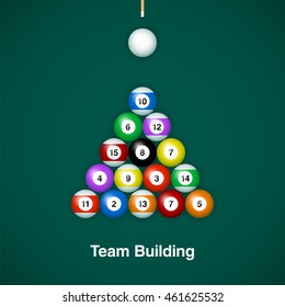Placed billiard balls on table with cue on green table background. Team building concept design.