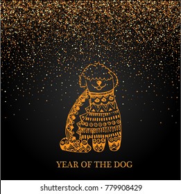 Placer gold bright sparkles sparkling confetti on a black background with a golden dog. Symbol of the year 2018.