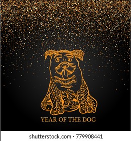 Placer gold bright sparkles sparkling confetti on a black background with a golden dog. Symbol of the year 2018.