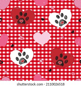 Plaid pattern baby red with Valentine's Day concept. Paw print with heart seamless fabric design pattern or background