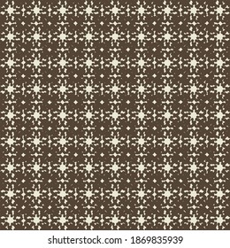 Plaid pattern consisting of small decorative elements and signs. Textile design.