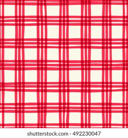 Plaid seamless pattern in red on cream background.