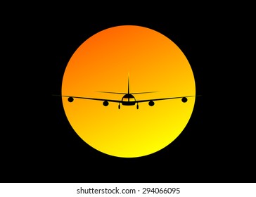 The plane against the sun and the sky of black color