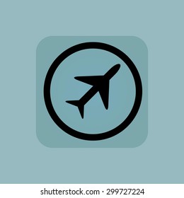 Plane in circle, in square, on pale blue background