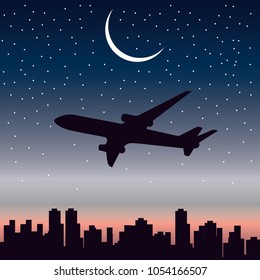 plane flying at night over the city