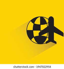 plane and globe with shadow on yellow background