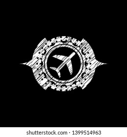 plane icon inside chalkboard emblem written on a blackboard
