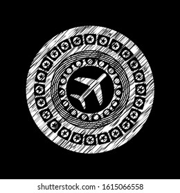 plane icon inside chalkboard emblem written on a blackboard