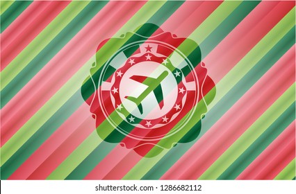 plane icon inside christmas colors style badge.