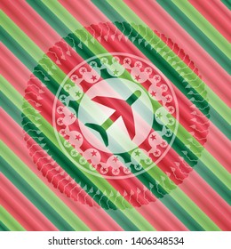 plane icon inside christmas colors style emblem.
