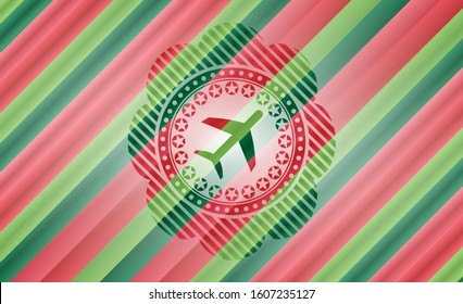 plane icon inside christmas colors style emblem.