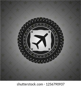 plane icon inside dark badge or emblem