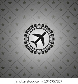 plane icon inside dark emblem