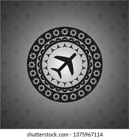 plane icon inside dark emblem