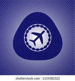 plane icon inside denim background