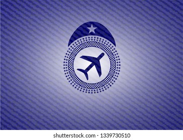 plane icon inside emblem with denim texture
