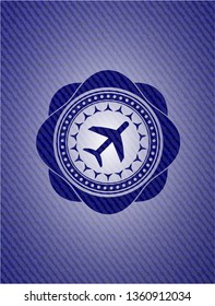 plane icon inside emblem with denim texture