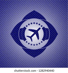 plane icon inside emblem with jean high quality background