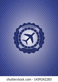 plane icon inside emblem with jean texture