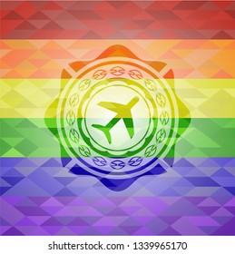 plane icon inside emblem on mosaic background with the colors of the LGBT flag