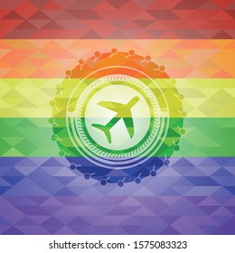 plane icon inside emblem on mosaic background with the colors of the LGBT flag
