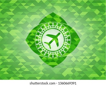 plane icon inside green emblem with mosaic background