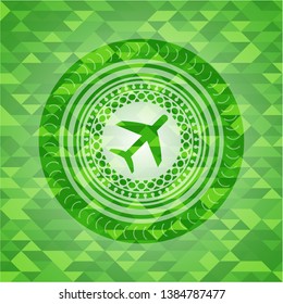 plane icon inside green emblem with mosaic background