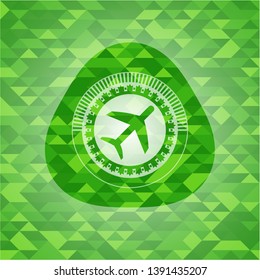 plane icon inside green emblem. Mosaic background