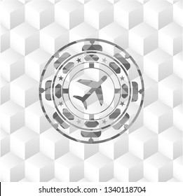 plane icon inside grey badge with geometric cube white background