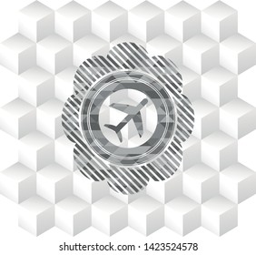 plane icon inside grey badge with geometric cube white background