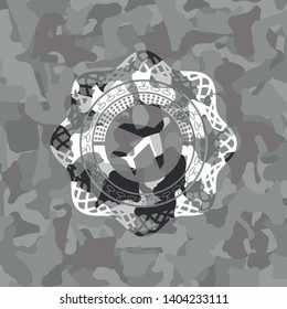 plane icon inside grey camouflage emblem