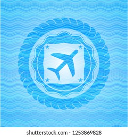 plane icon inside light blue water emblem.