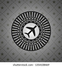 plane icon inside realistic dark emblem