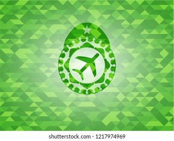 plane icon inside realistic green mosaic emblem