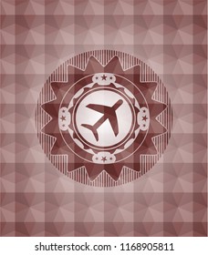 plane icon inside red seamless emblem with geometric pattern.