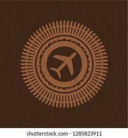 plane icon inside retro style wooden emblem
