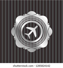 plane icon inside silver badge
