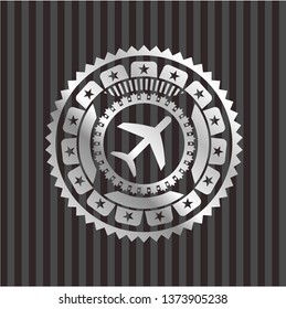 plane icon inside silver badge
