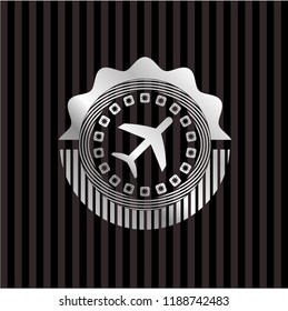 plane icon inside silver emblem