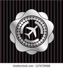plane icon inside silver emblem