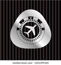 plane icon inside silver emblem or badge
