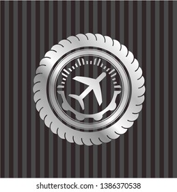plane icon inside silver emblem