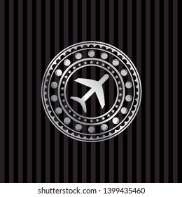 plane icon inside silver emblem