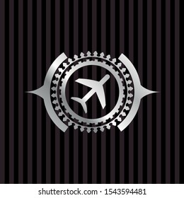 plane icon inside silver emblem