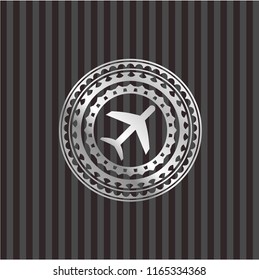 plane icon inside silver shiny badge