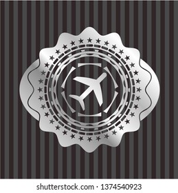 plane icon inside silver shiny badge