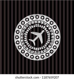 plane icon inside silvery badge
