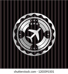 plane icon inside silvery badge or emblem