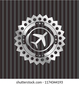 plane icon inside silvery emblem